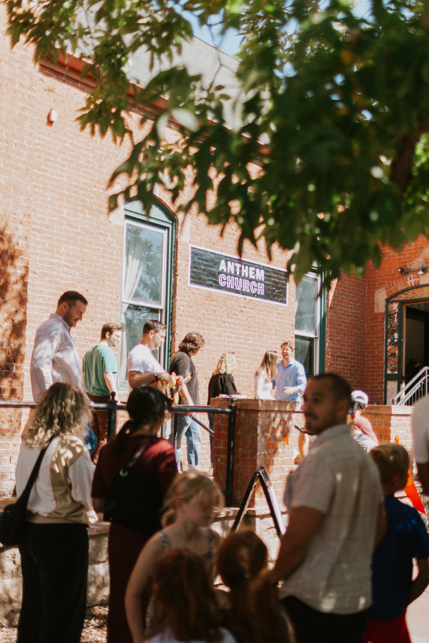 Anthem Church building exterior with people outside